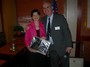 Marc O'Brien presenting a token of appreciation to President Denise during her final meeting as President.